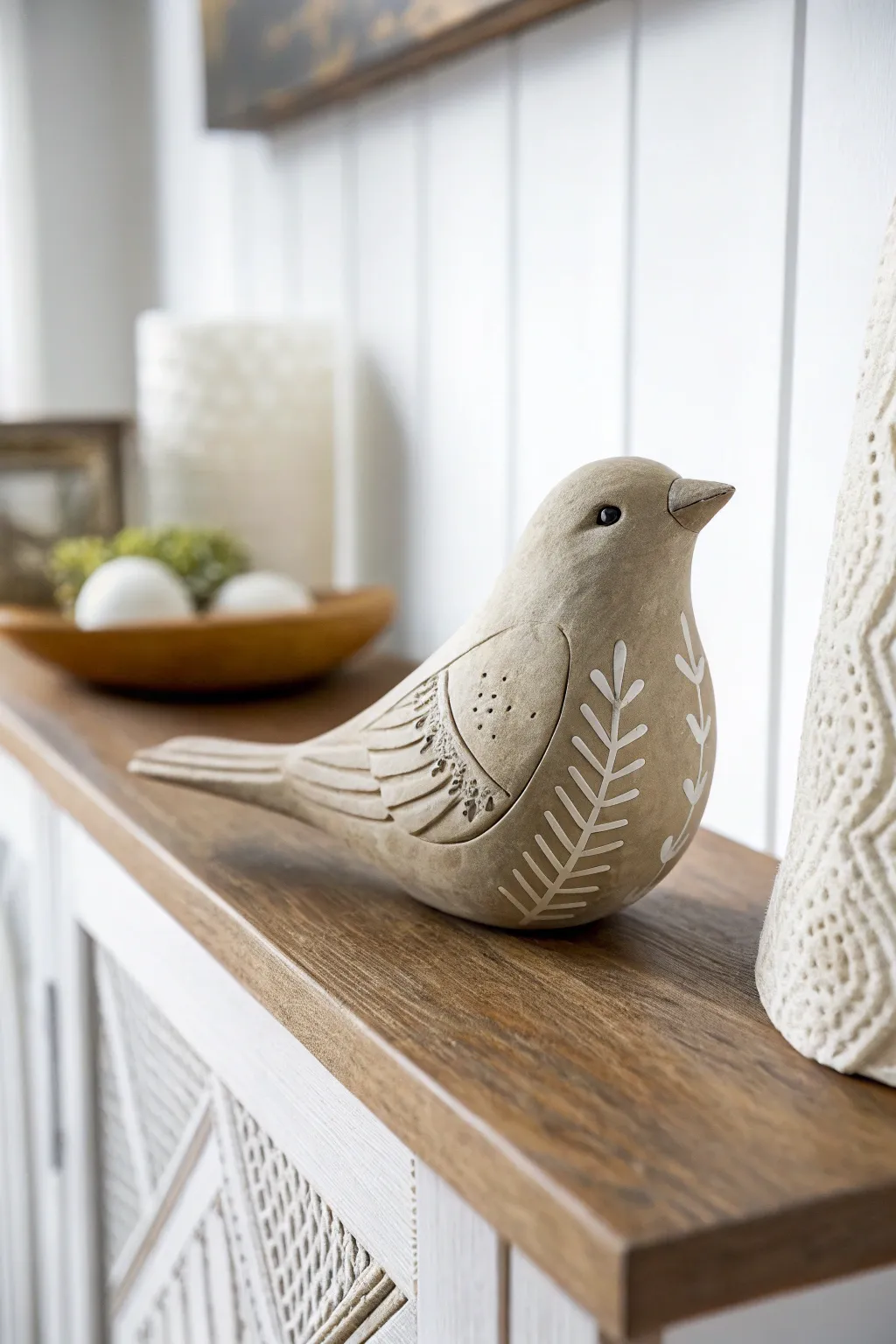 Bring a touch of whimsy to your space with this elegantly crafted clay bird.
