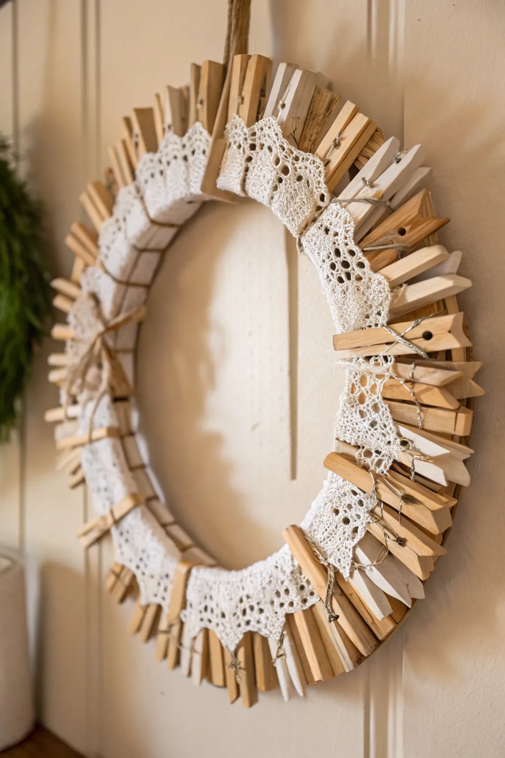 Embrace vintage charm with this elegant clothespin and lace wreath, a timeless nod to the past.
