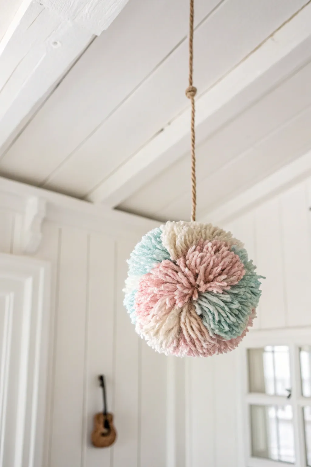 Elevate your holiday decor with charming DIY pom-poms, adding a touch of whimsy and warmth to your space.