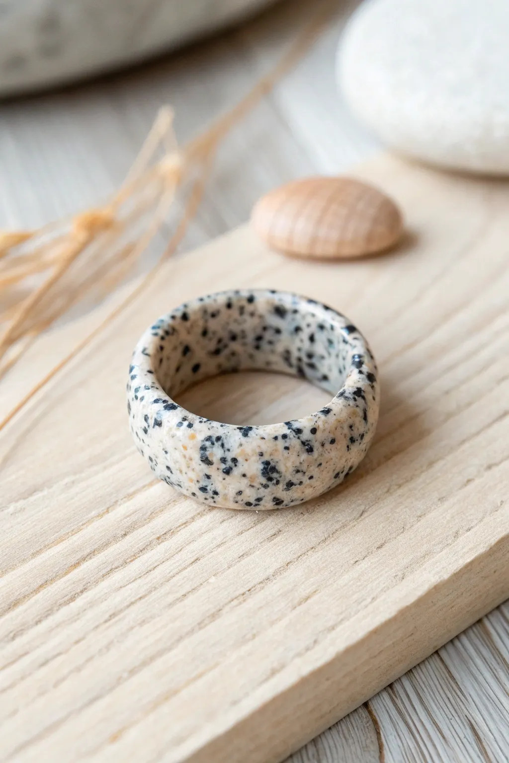 Craft your own minimalist faux granite ring with polymer clay; a perfect blend of modern elegance and artisanal charm.