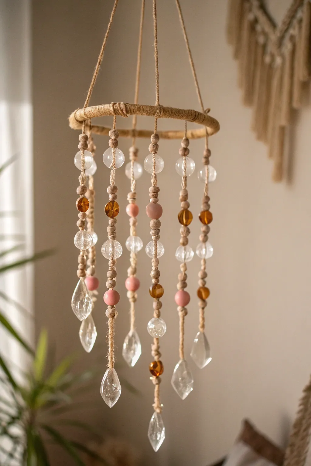 Add a touch of whimsy to your space with this stunning glass bead mobile, a perfect blend of minimalist and boho style.