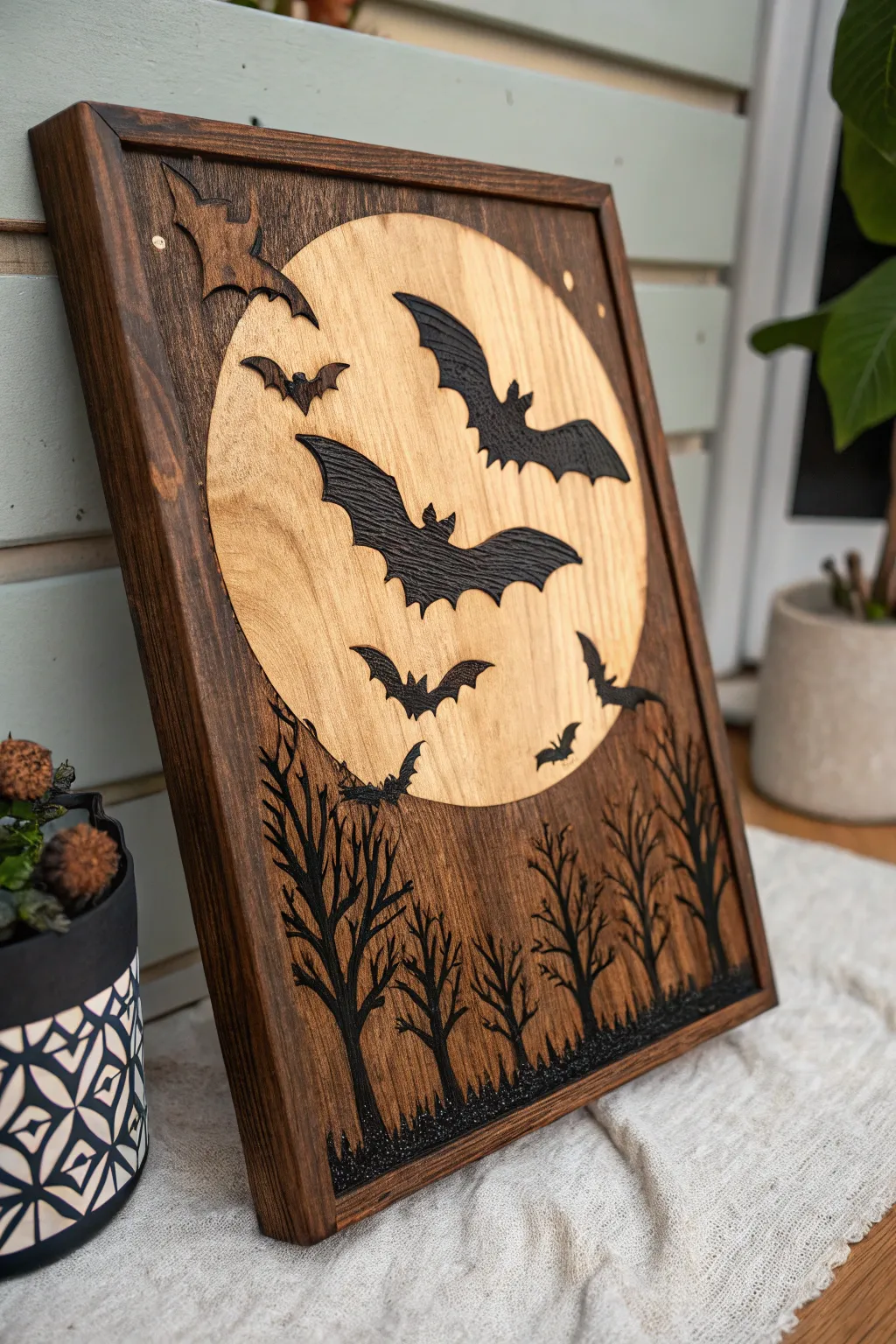 Soar into the night with mystical bats: a masterful wood-burning creation.