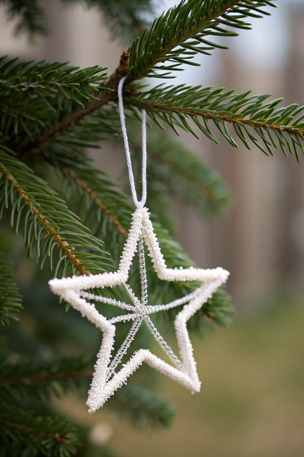 Add a whimsical touch to your holiday decor with handmade pipe cleaner ornaments.