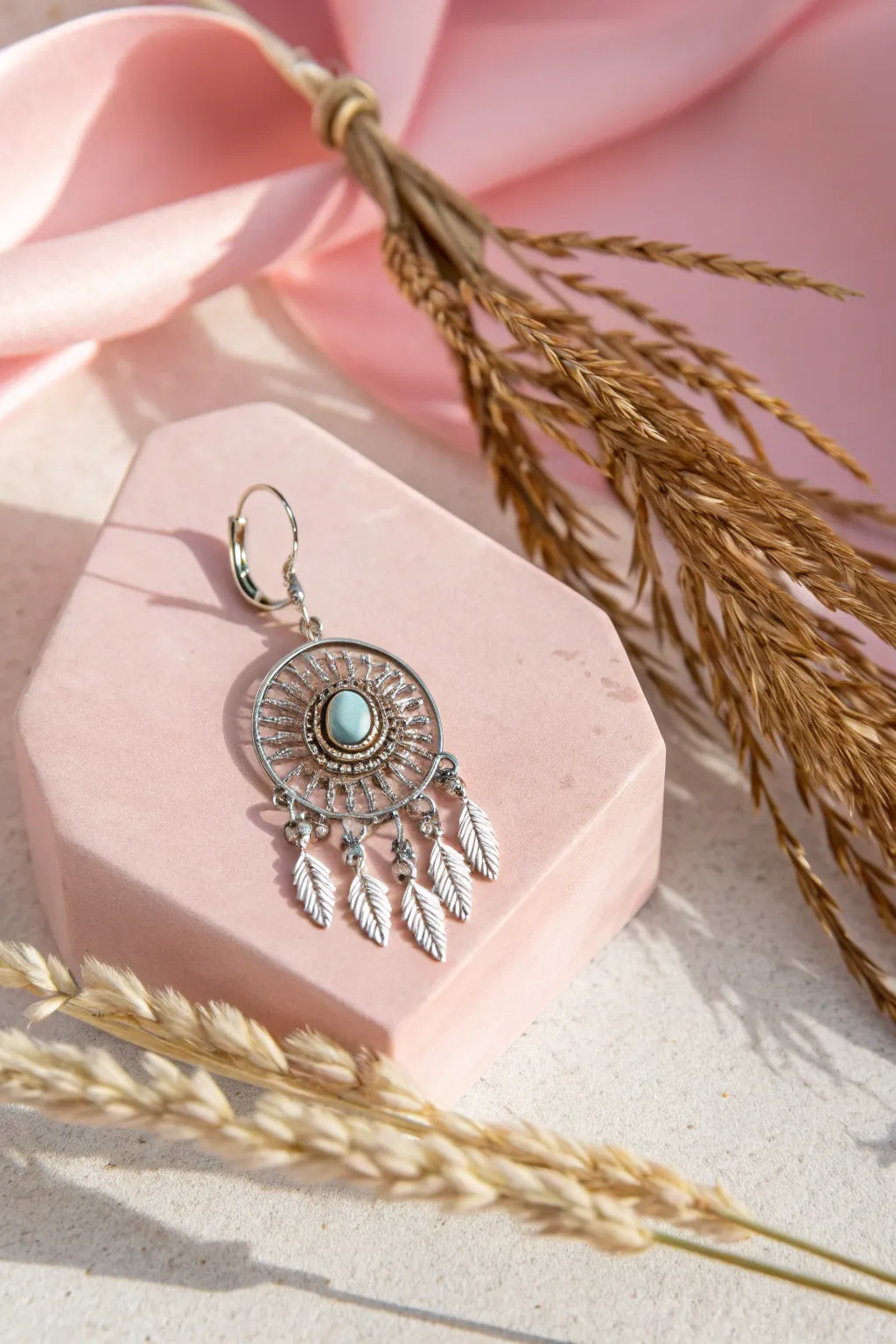 Elevate your earring photography with a pop of pastel elegance.