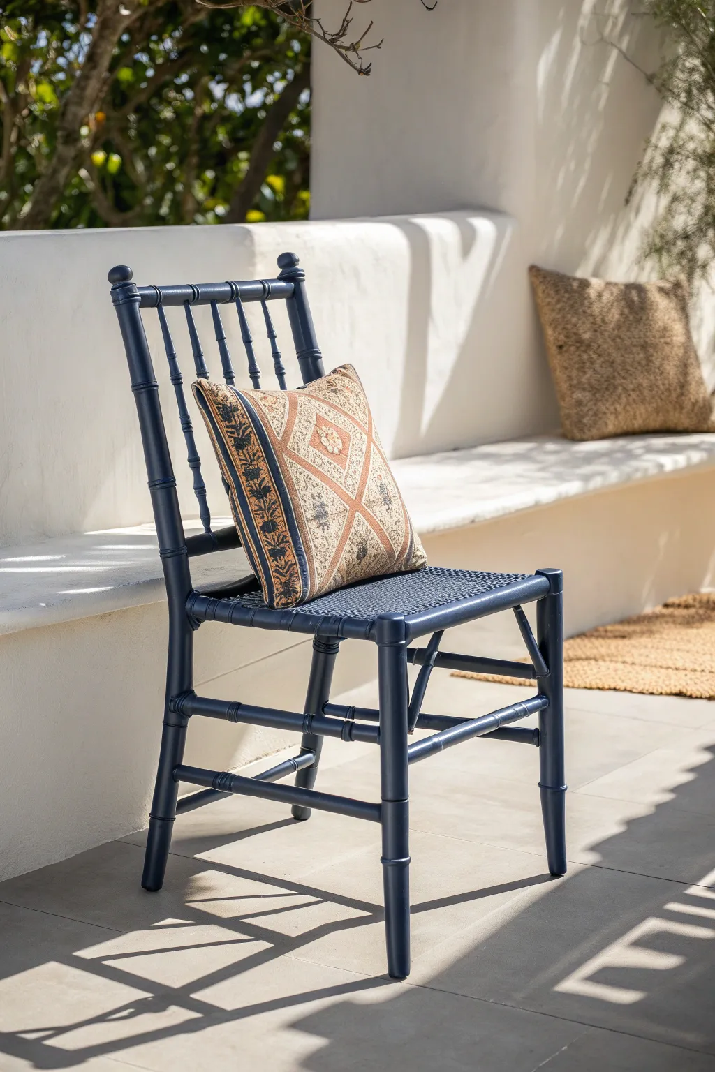 Elevate your outdoor space with the timeless charm of a navy blue bamboo chair, where minimalist design meets boho elegance.