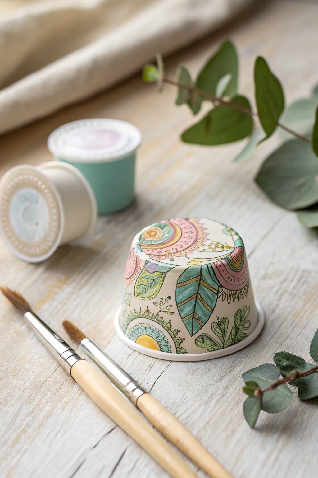 Transform your coffee pods into charming miniature paint pots for your creative moments!