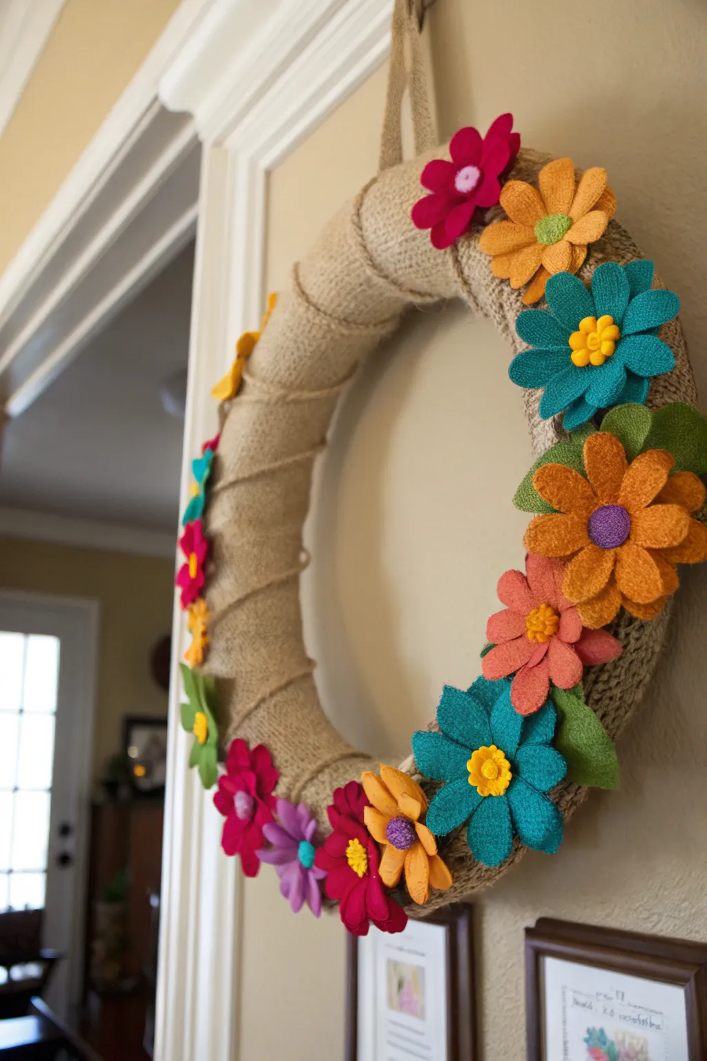 Felt flowers bring a cozy, handmade vibe to this burlap wreath.