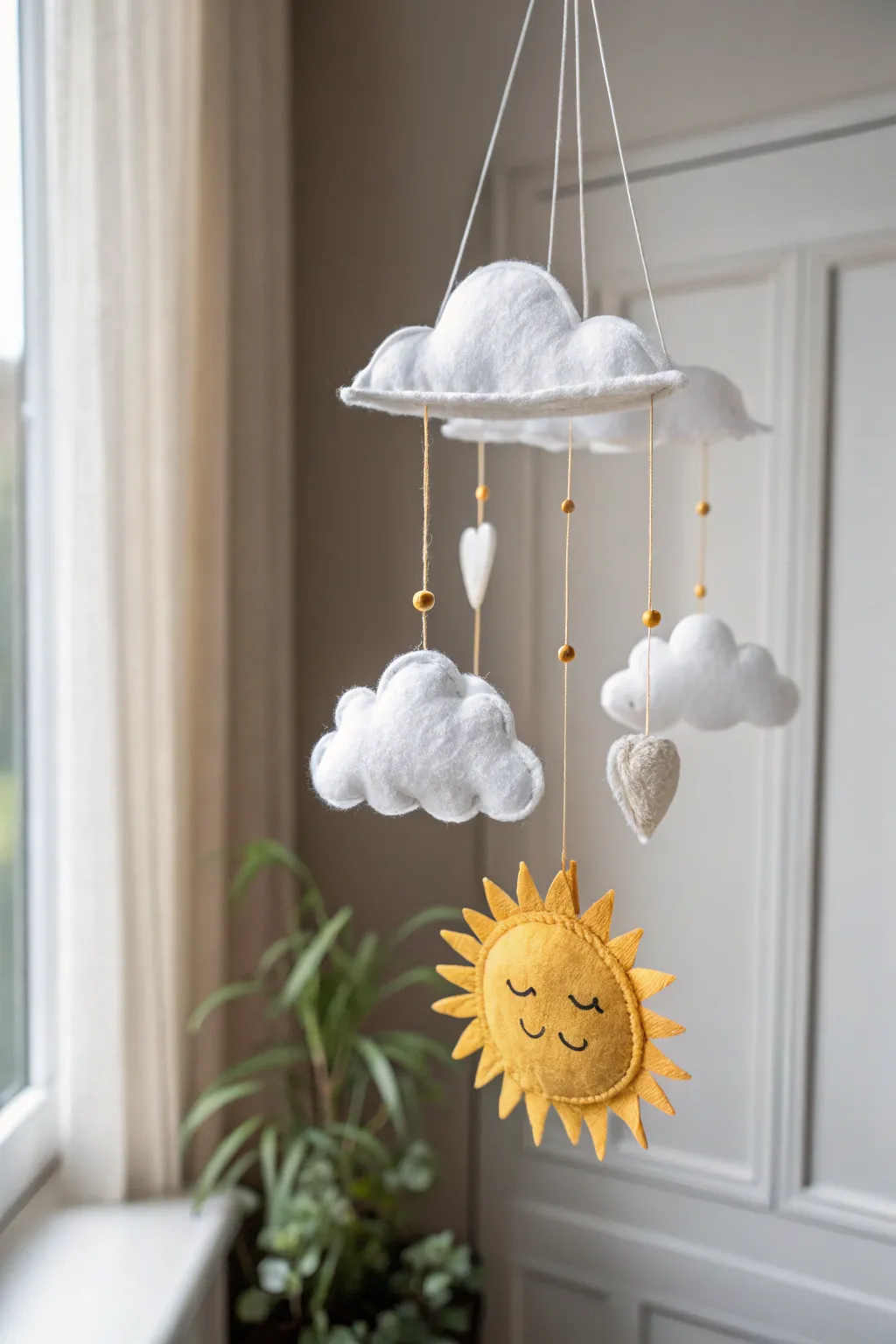 Bring a touch of the sky indoors with this charming cloud and sun mobile, perfect for adding a whimsical and serene vibe to any nursery or playroom.