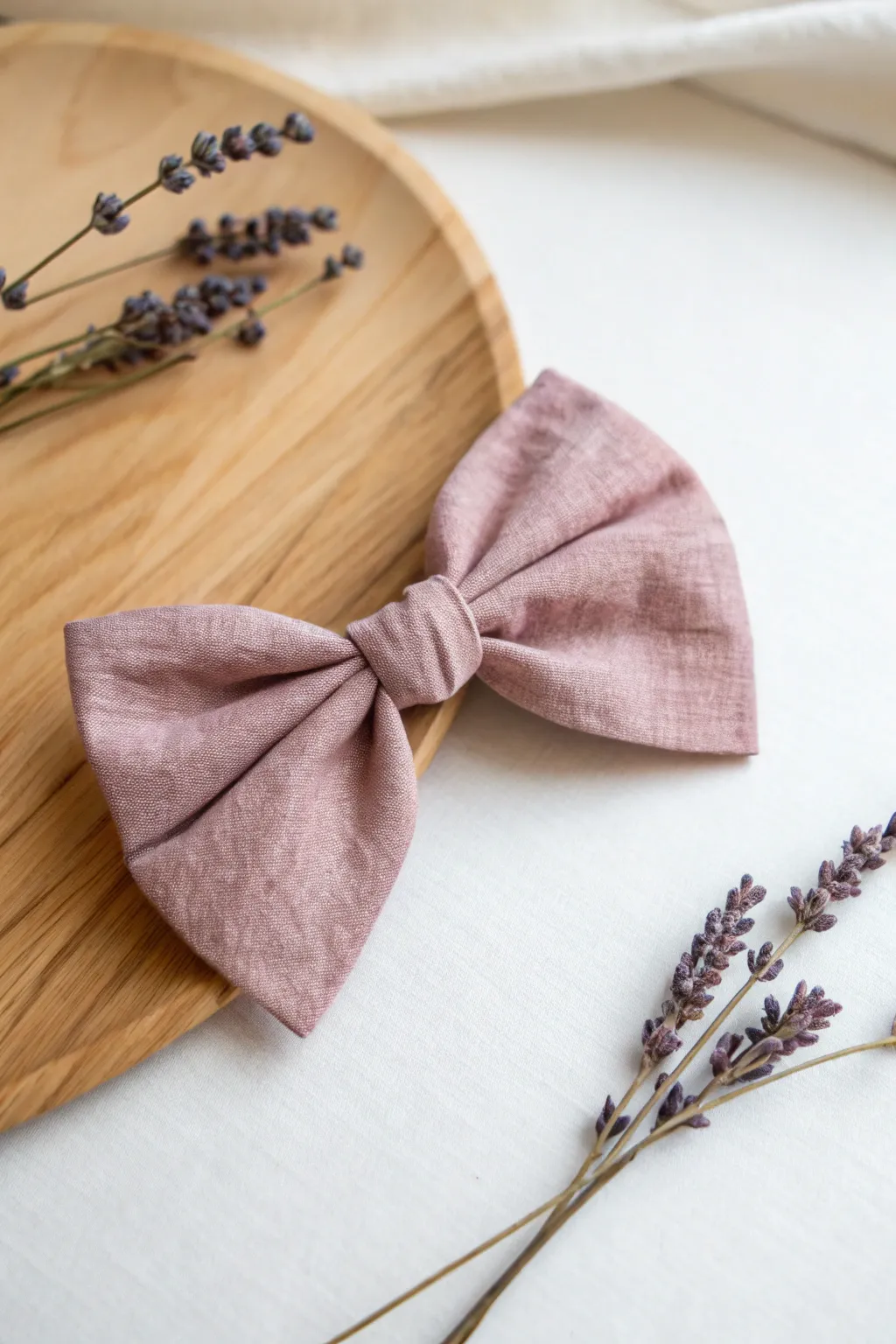 Embrace the charm of simplicity with this delicate mini bow, a perfect touch for your accessories.