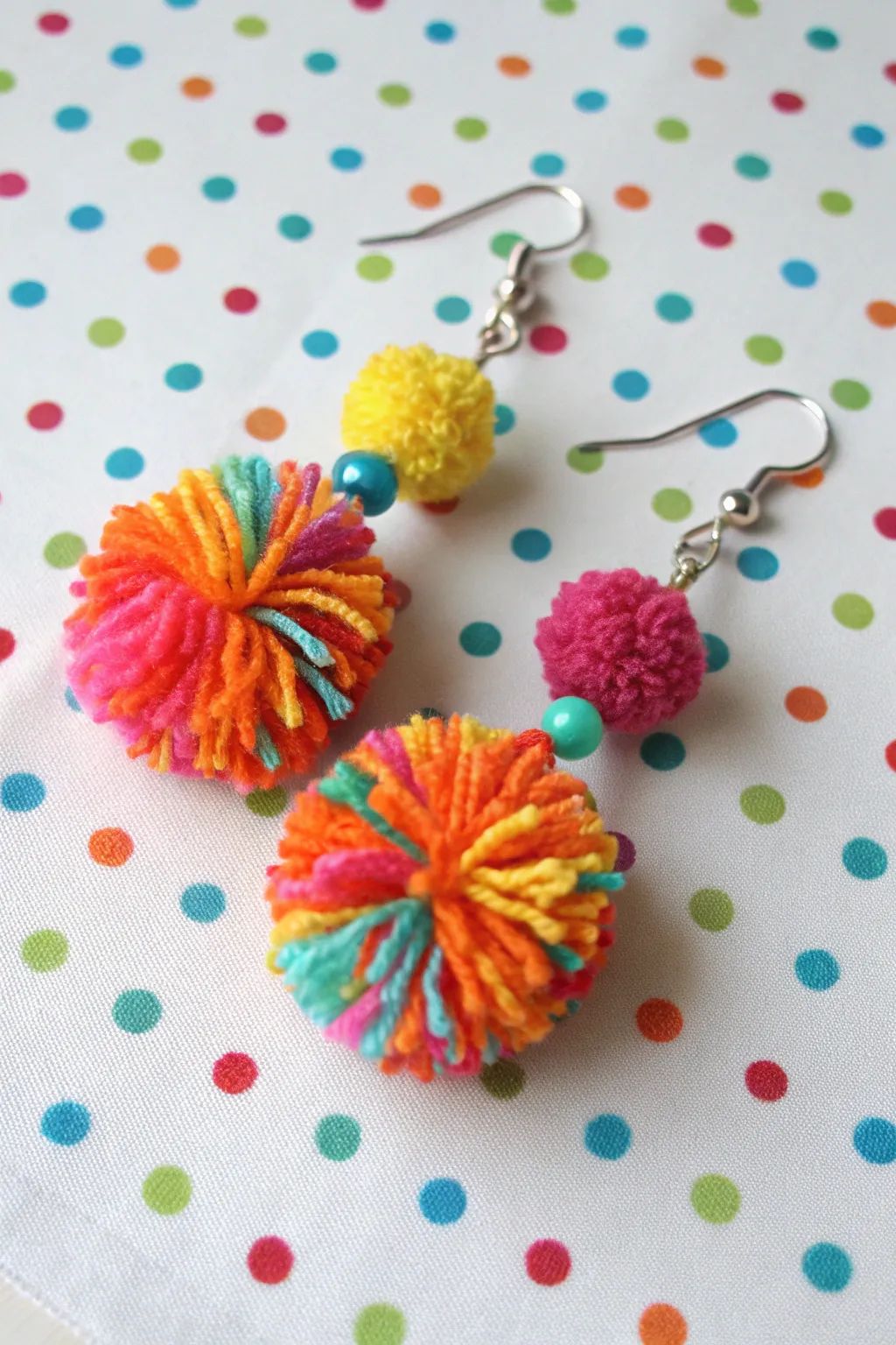 Playful pom-pom earrings that add a touch of joy to any outfit.