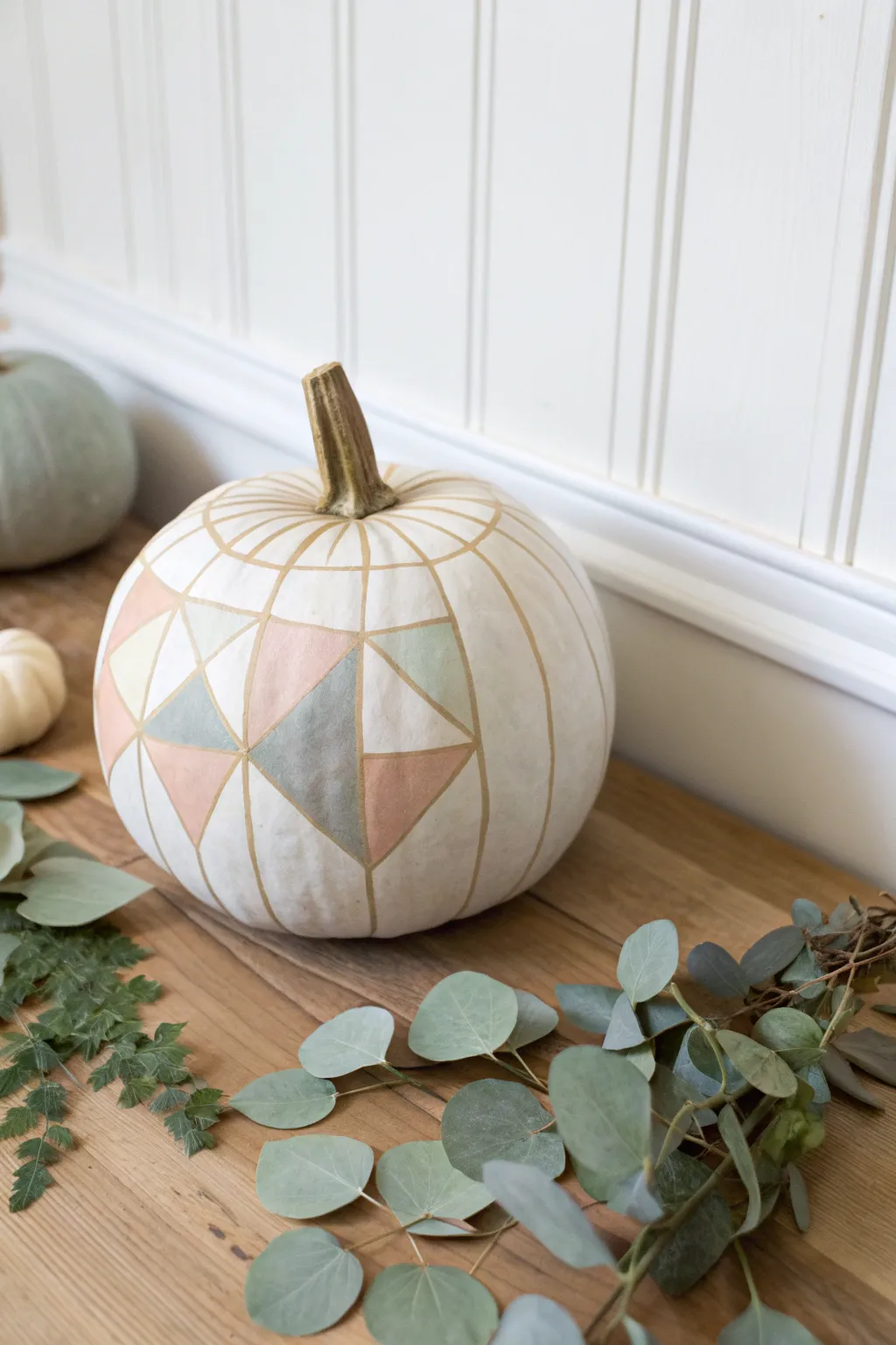 Elevate your autumn decor with minimalist geometric pumpkin art.