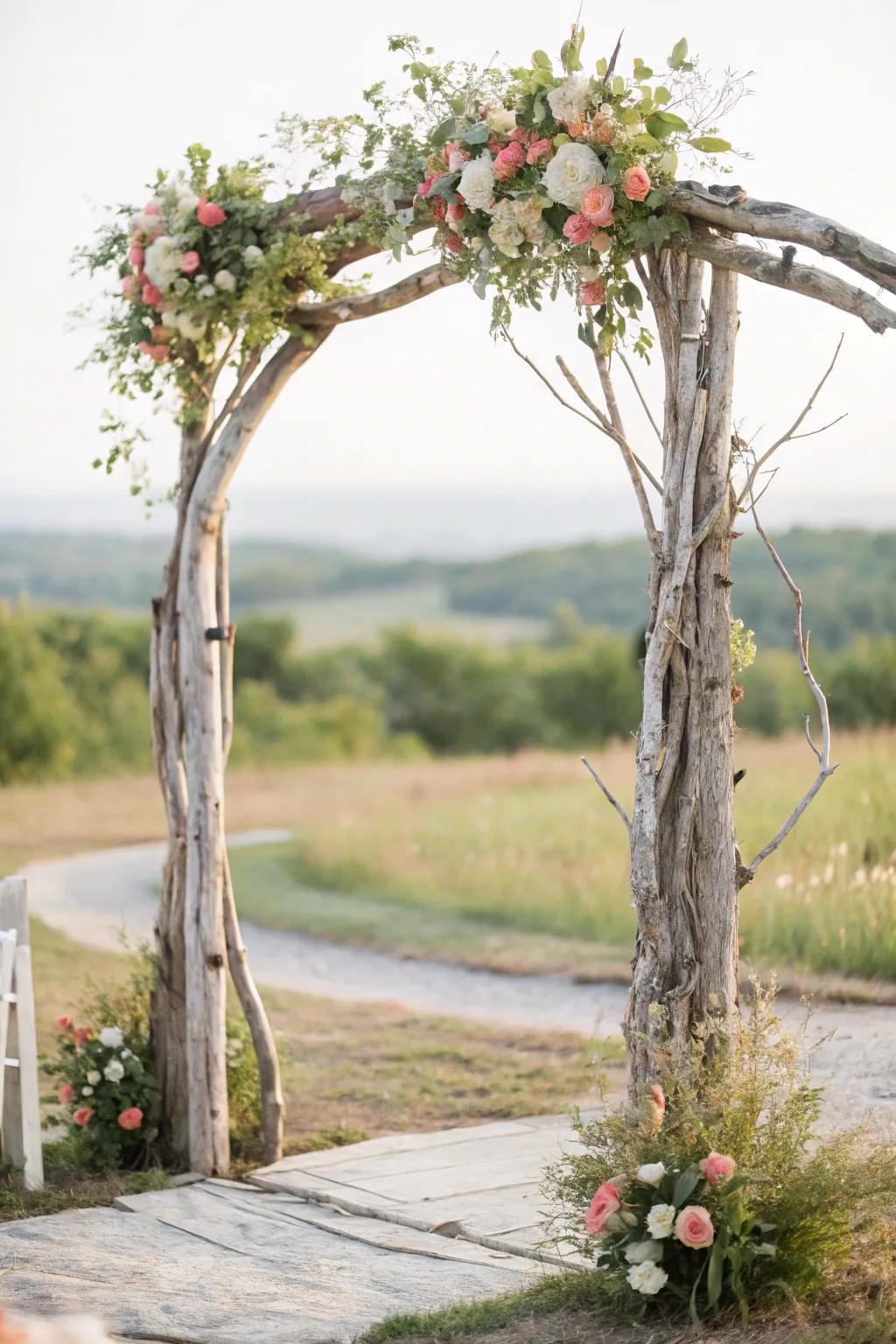 Capture the essence of rustic romance with a driftwood wedding arch adorned with wild blooms.