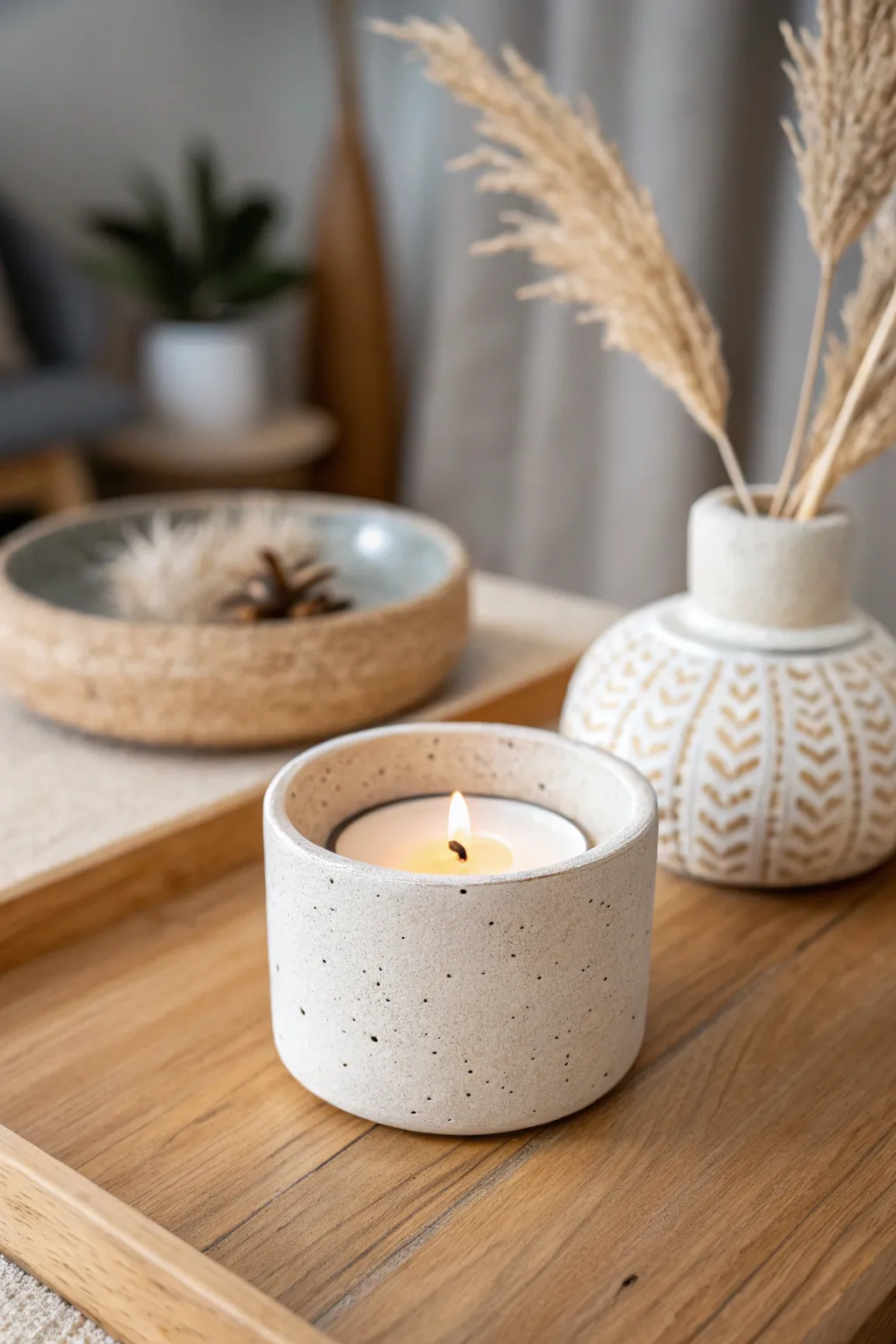 Illuminate your space with the serene beauty of a faux stoneware candle holder, crafted to perfection.