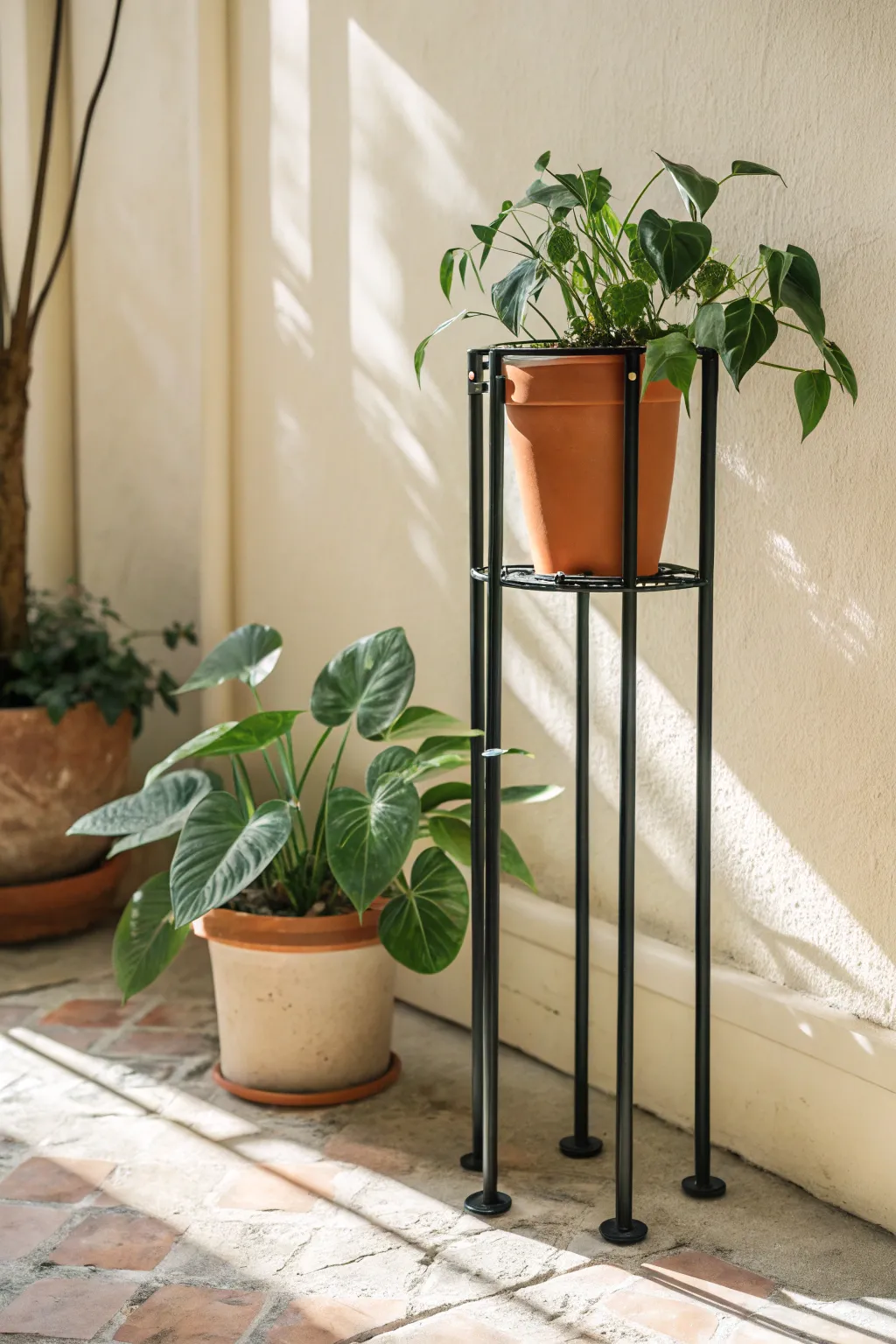 Elevate your greenery with industrial elegance: A metal pipe plant stand that's both chic and easy to assemble.