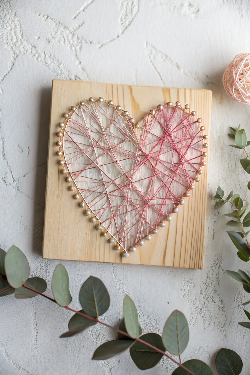 Add a heartfelt touch to your space with DIY string art that's both simple and stunning.
