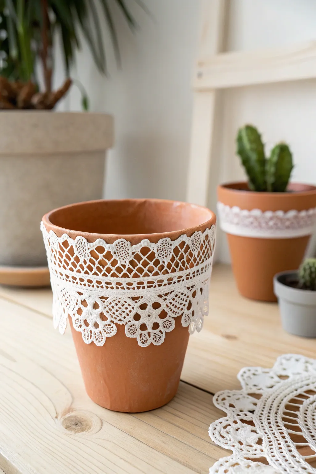 Elevate your plant decor with a touch of elegance using charming doily wraps.
