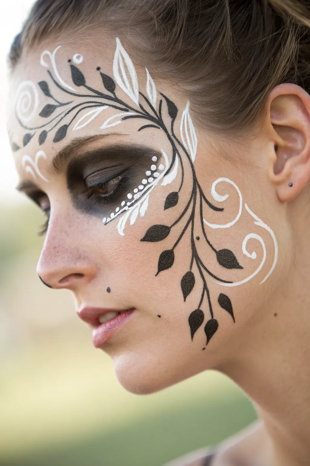Embrace the elegance of swirling vines and let your natural beauty shine with this minimalist face paint design.