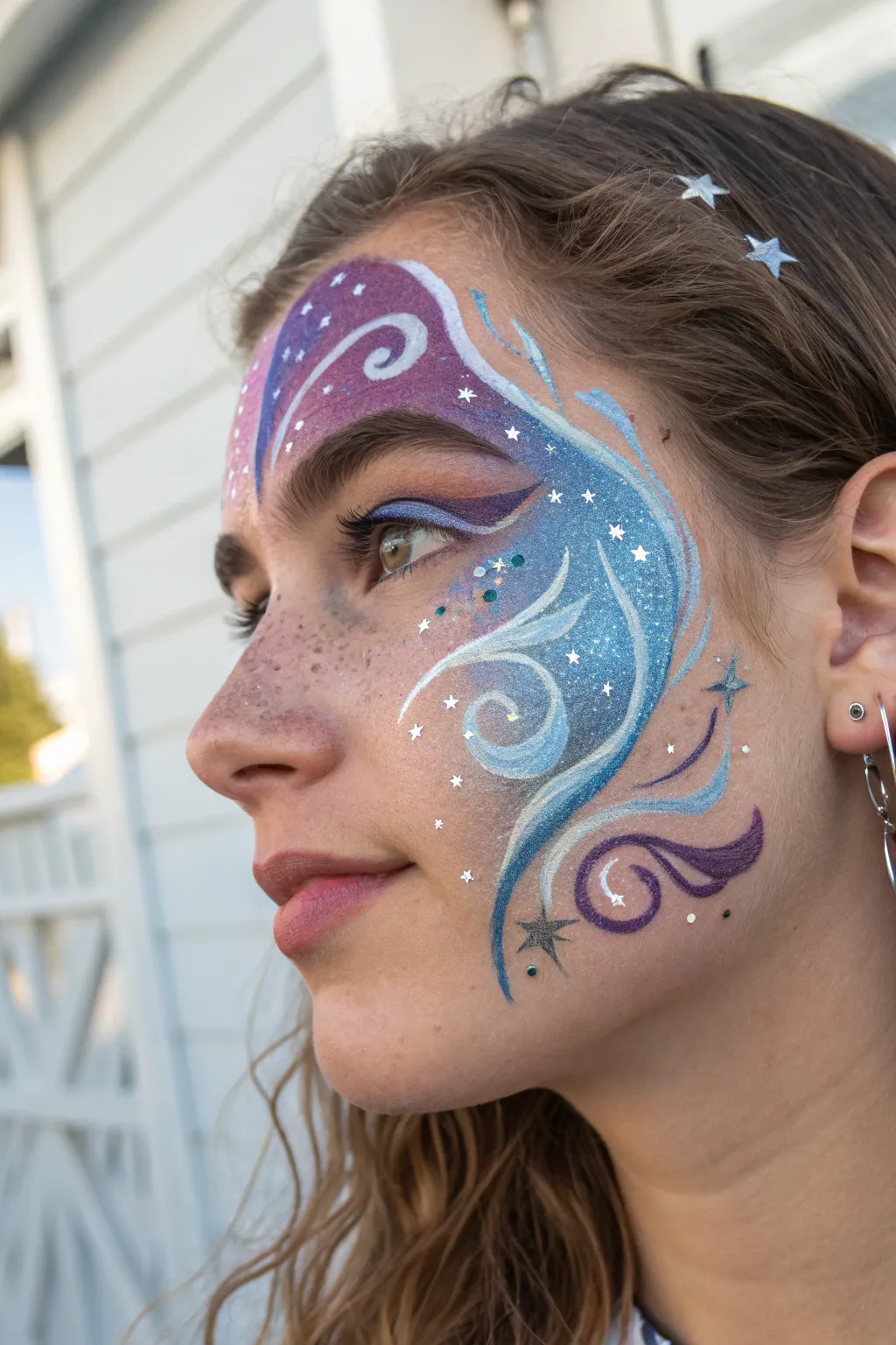 Embrace the cosmos with a dazzling galaxy face paint, perfect for adding a touch of magic to your evening look.