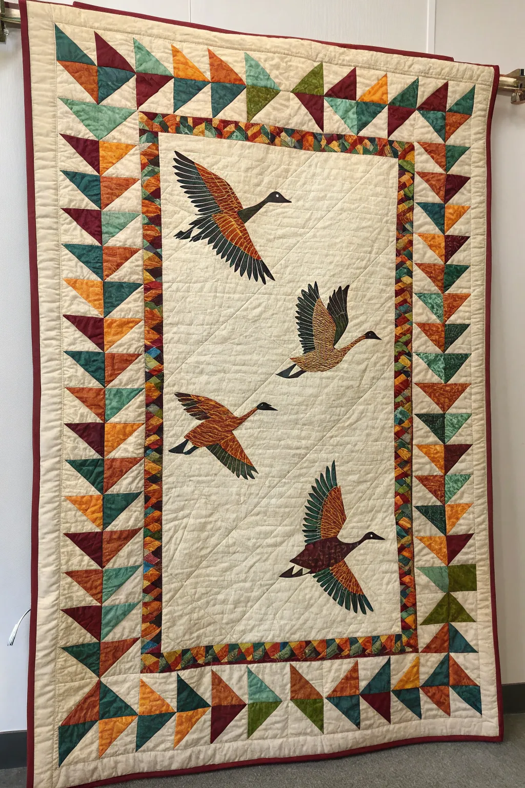 Artistic asymmetrical flying geese borders for a creative twist.
