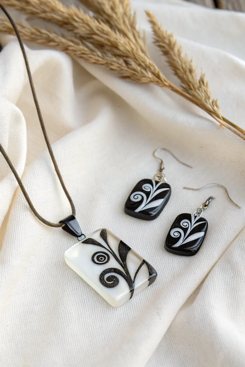 Timeless elegance in black and white: Discover the artistry of fused glass jewelry.