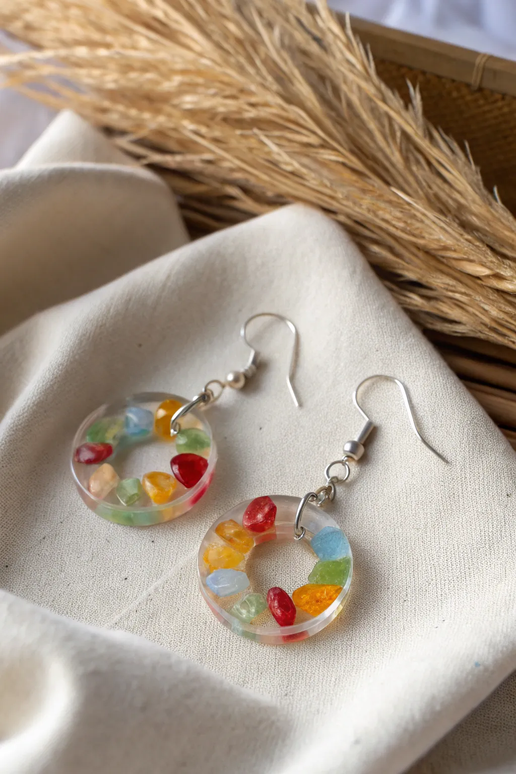 Capture the light with these stunning resin and glass earrings, where minimalism meets vibrant beauty.