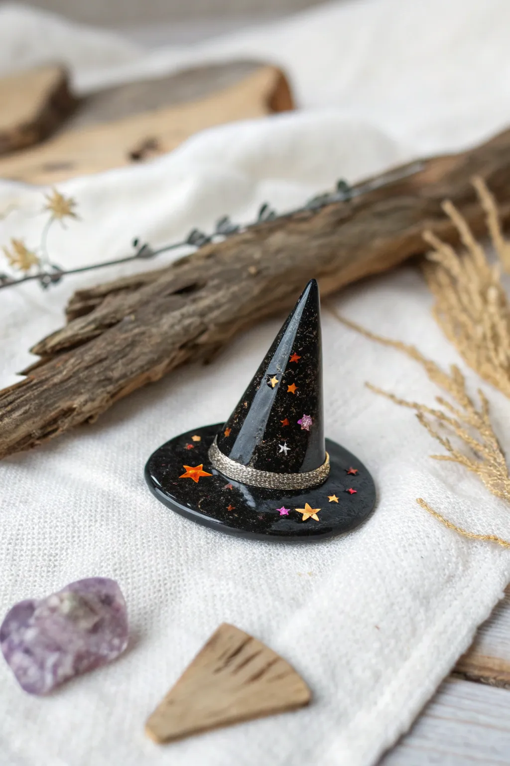 Add a touch of magic to your home with this enchanting resin witch hat magnet.