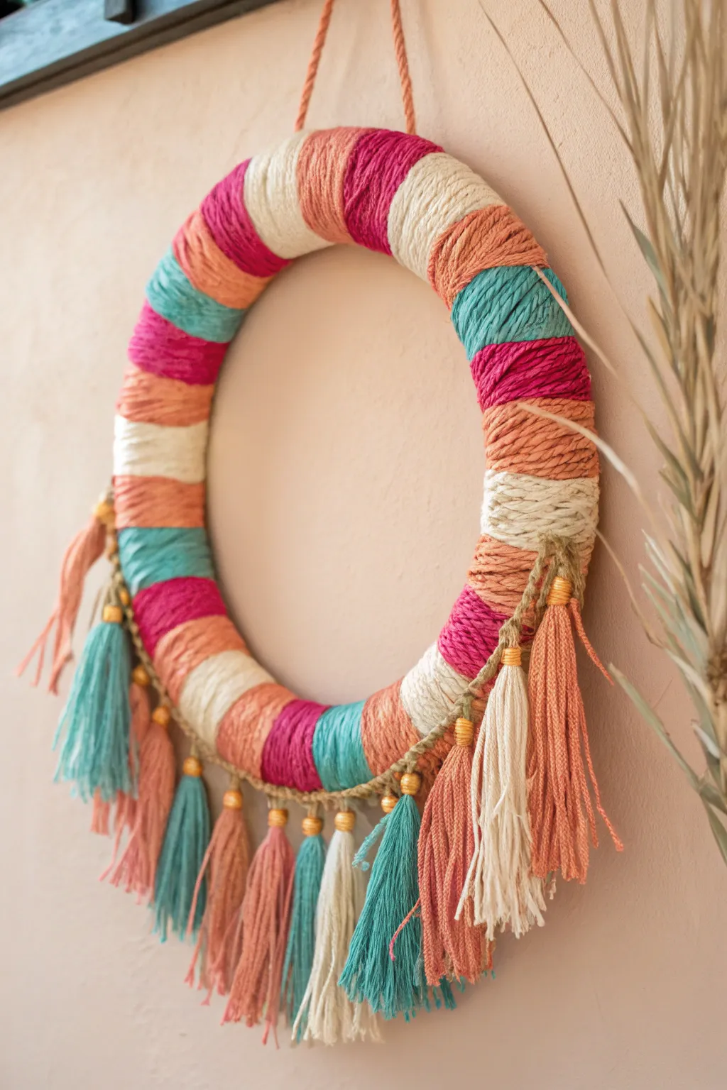 Embrace summer with this vibrant raffia ribbon wreath – a perfect blend of playful elegance and natural beauty.
