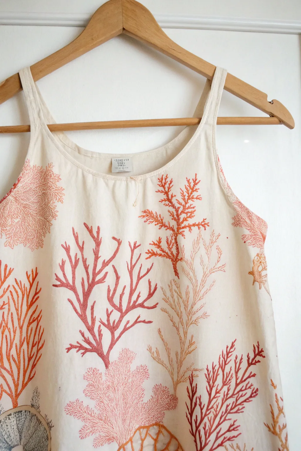 Embrace the ocean's beauty with this handcrafted coral-patterned mermaid top. Simple elegance meets artistic charm.