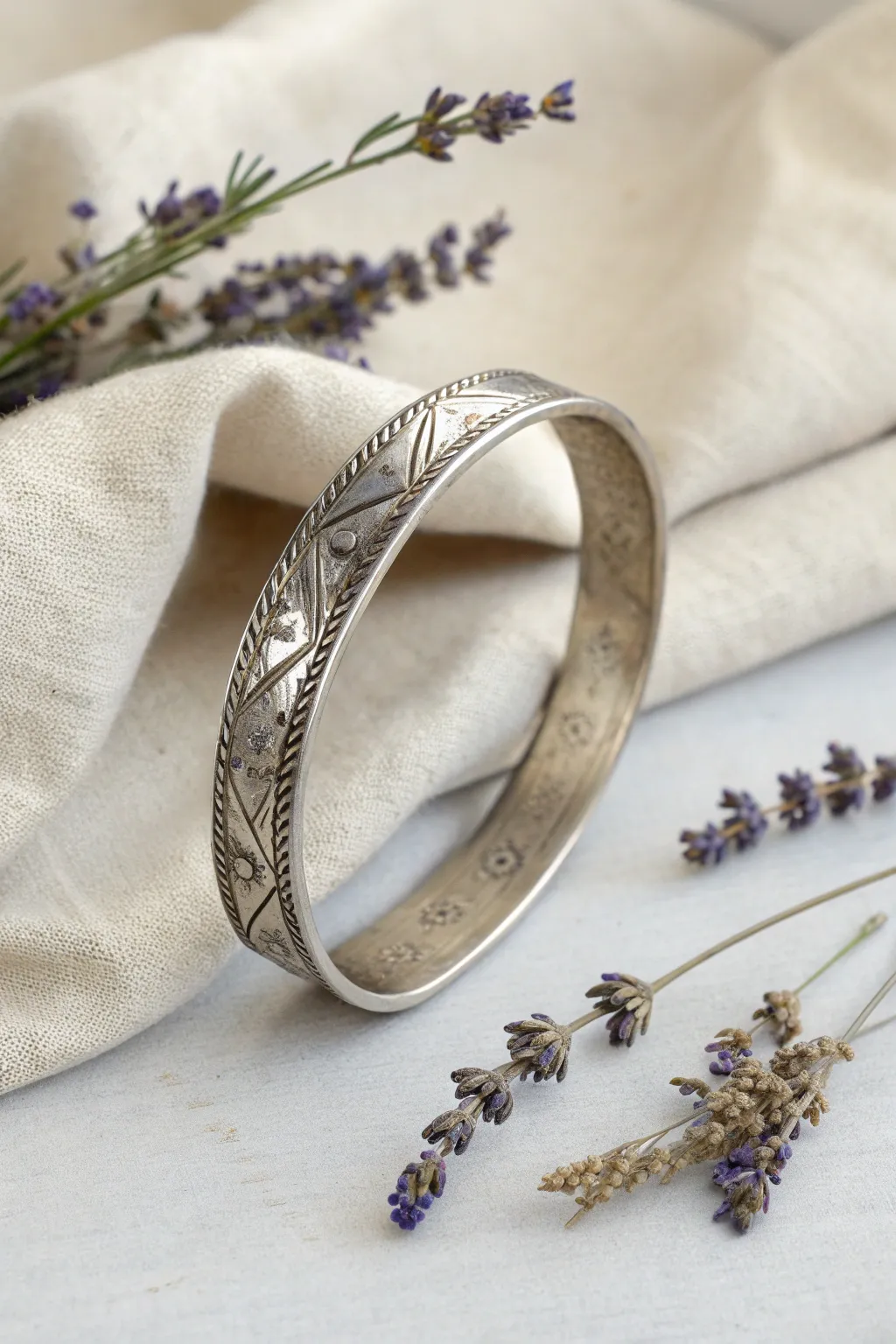 Elevate your style with this beautifully crafted engraved metal bangle, where simplicity meets meaningful design.
