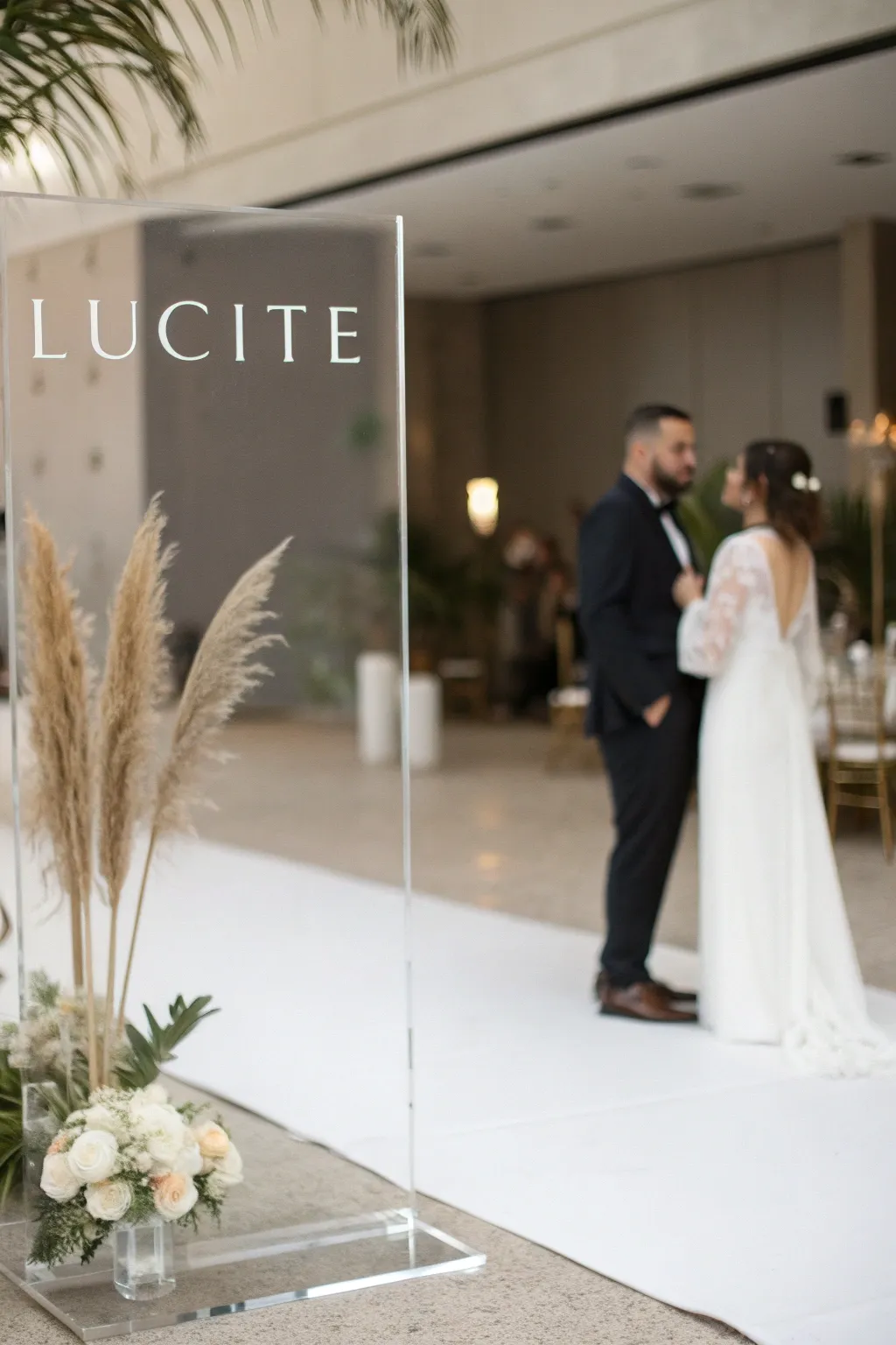 Lucite signage that adds a modern touch to minimalist weddings.