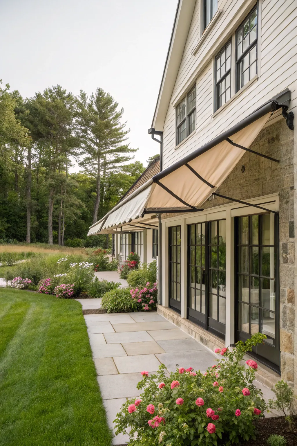 Natural fiber awnings add eco-friendly charm to this farmhouse.