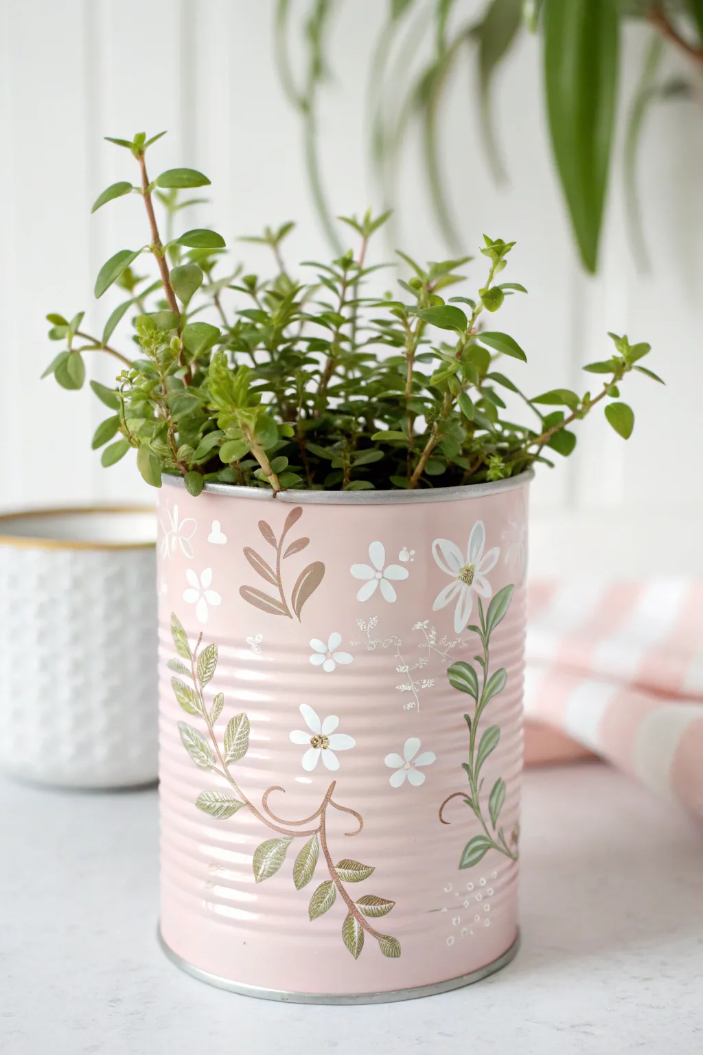 Breathe new life into tin cans with artistry and greenery. An eco-friendly Mother's Day craft that's as delightful as it is simple.