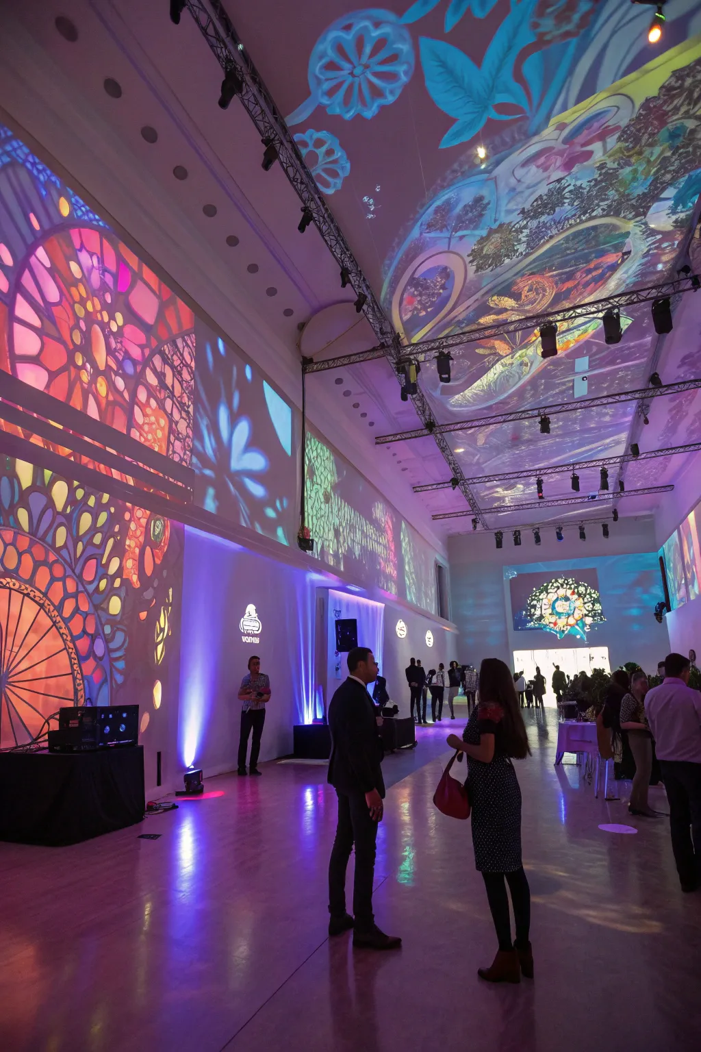 Projection mapping transforms the space with dynamic visuals, offering a modern and immersive experience.