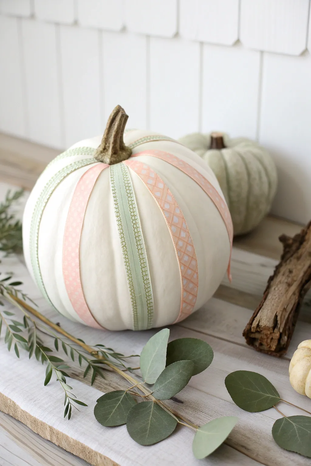 Elevate your Thanksgiving decor with a touch of minimalist charm using fabric tape pumpkins.