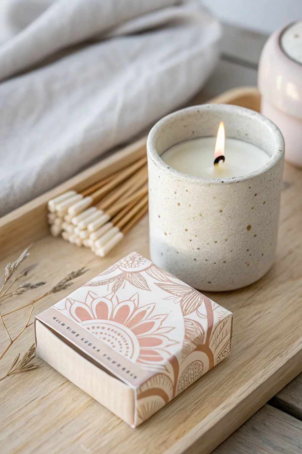 Elevate your baby shower with these charming DIY candle and matchbox favors, a perfect blend of simplicity and elegance.