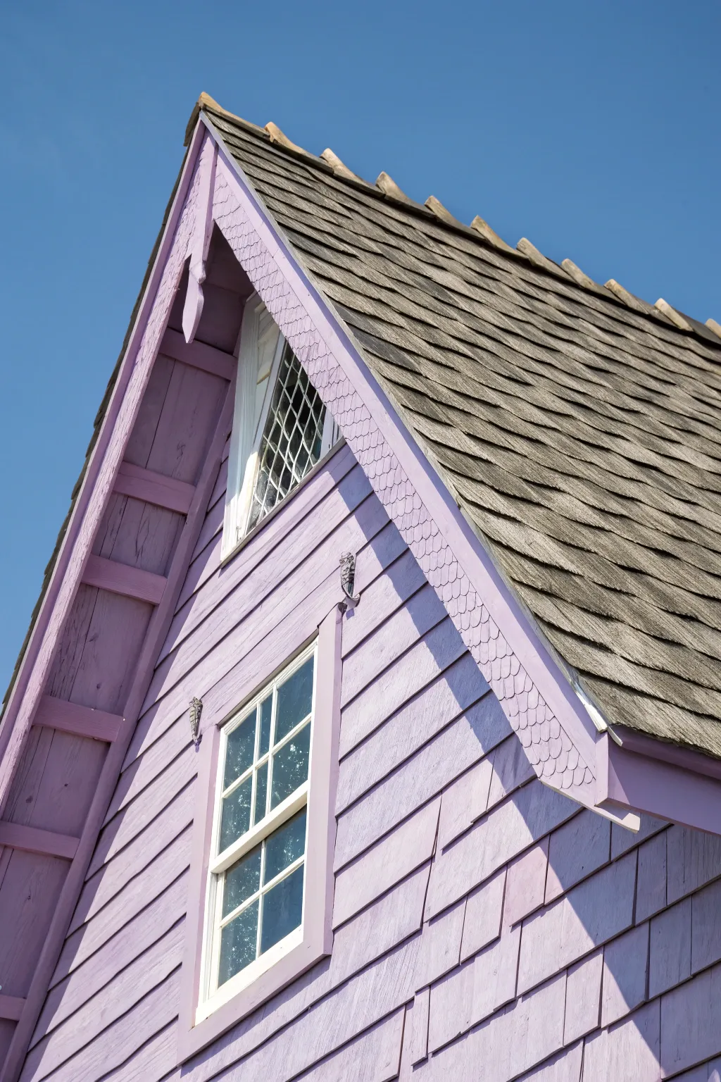 A whimsical touch: Lavender-hued cedar shake gable adds charm and conversation to your home.