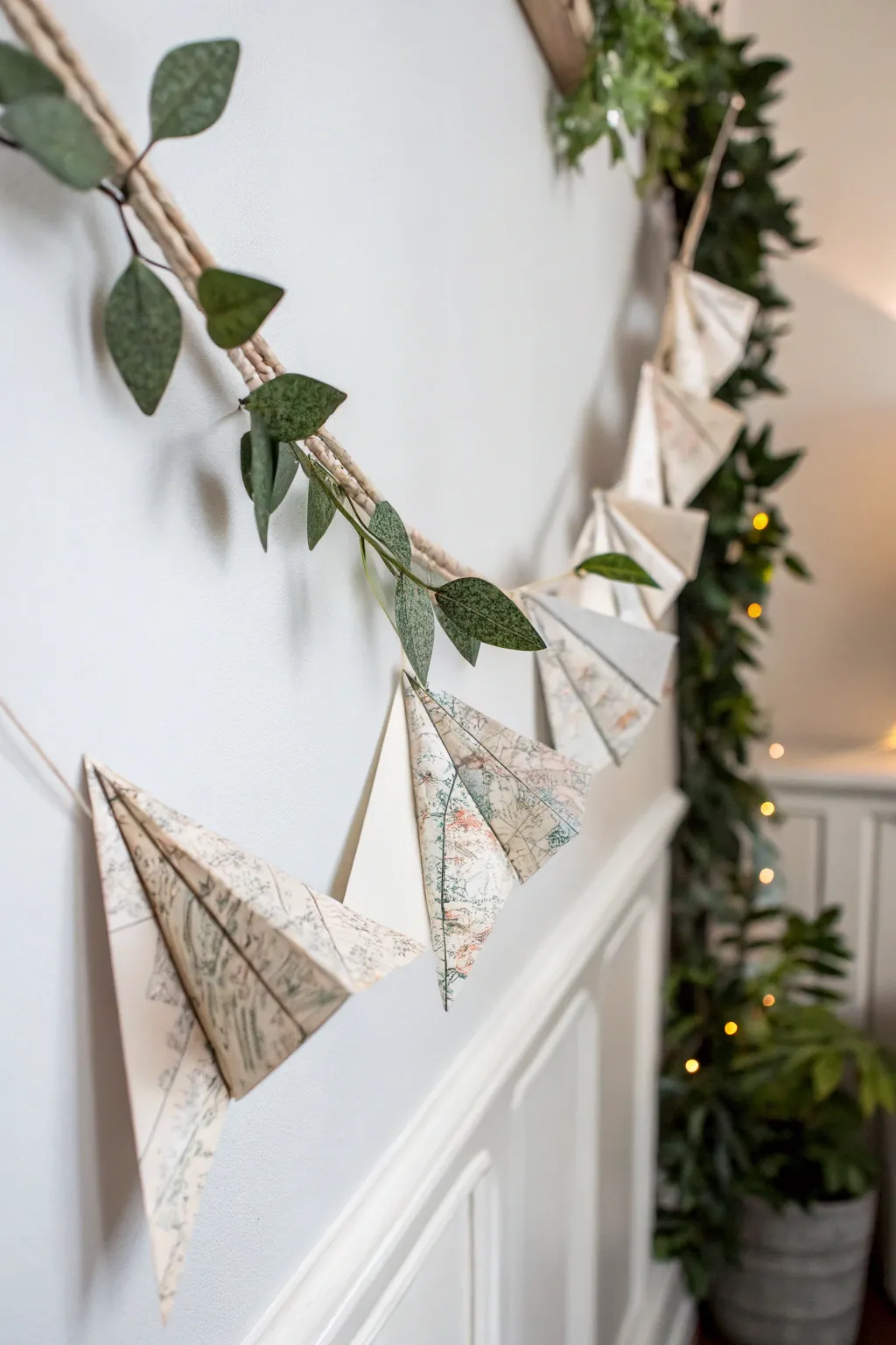 Craft a conversation starter: a paper airplane garland from vintage maps for Father's Day.