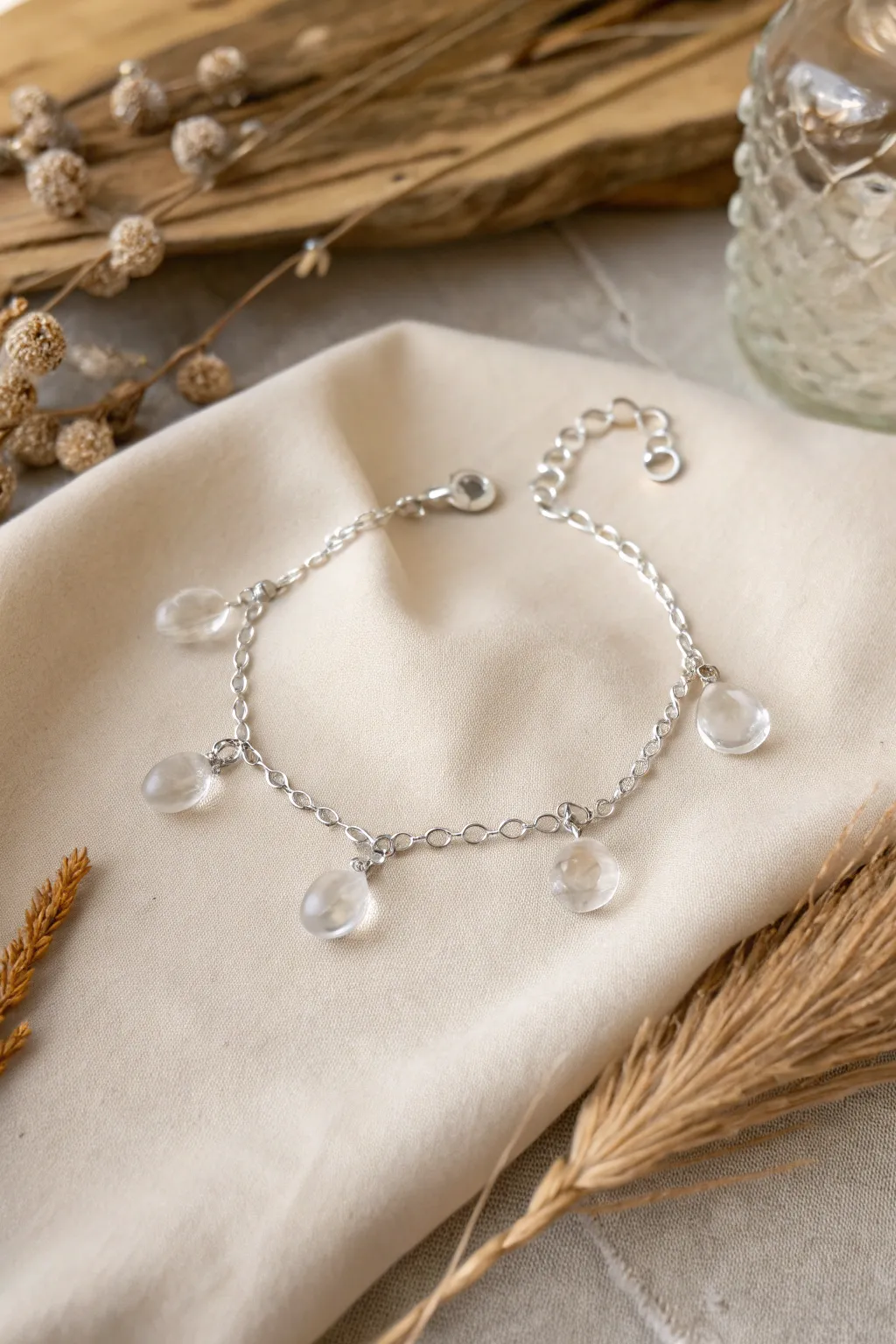 Embrace natural elegance with a dew drop charm bracelet – a minimalist's dream.