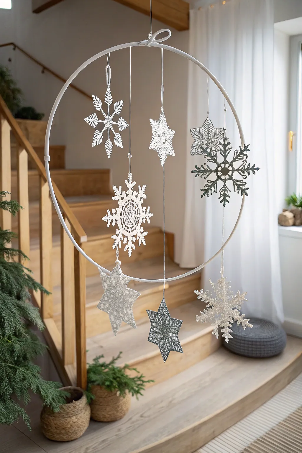 Elevate your holiday decor with a handmade snowflake mobile — a touch of winter wonder in minimalist style.