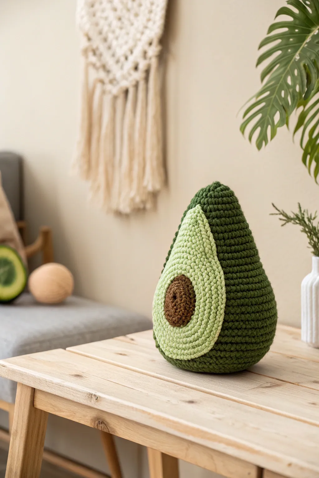 Add a touch of whimsy to your decor with this charming crochet avocado plushie.