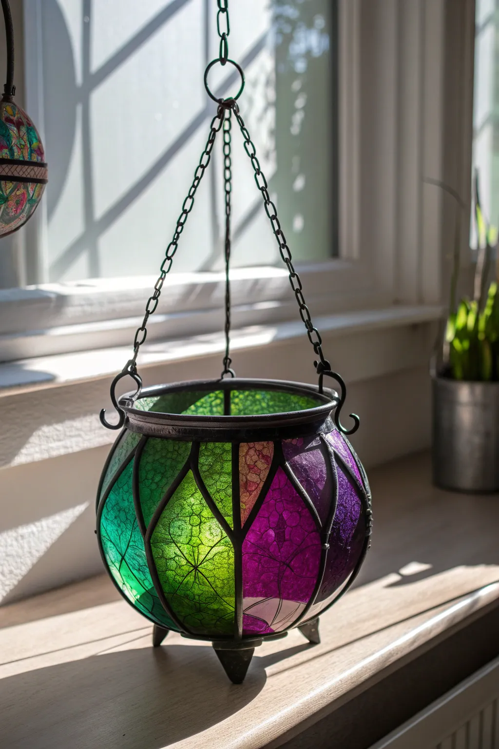 Catch the magic of sunlight with this enchanting stained glass cauldron, perfect for a whimsical Halloween touch!