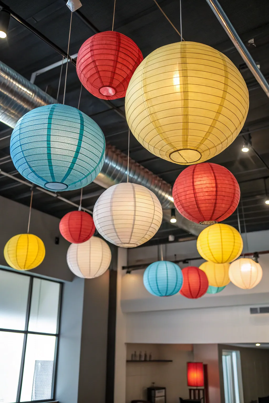 Illuminate your space with vibrant paper lanterns for a creative touch.