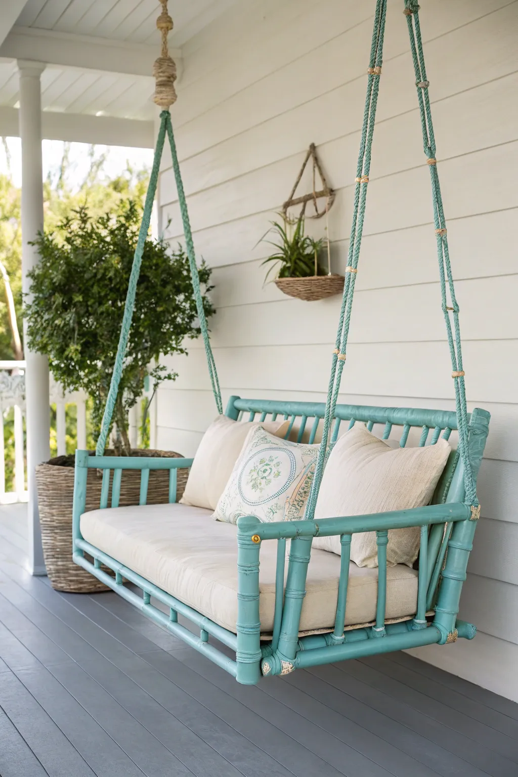 Welcome serenity and style with this turquoise bamboo porch swing – a perfect spot to unwind.