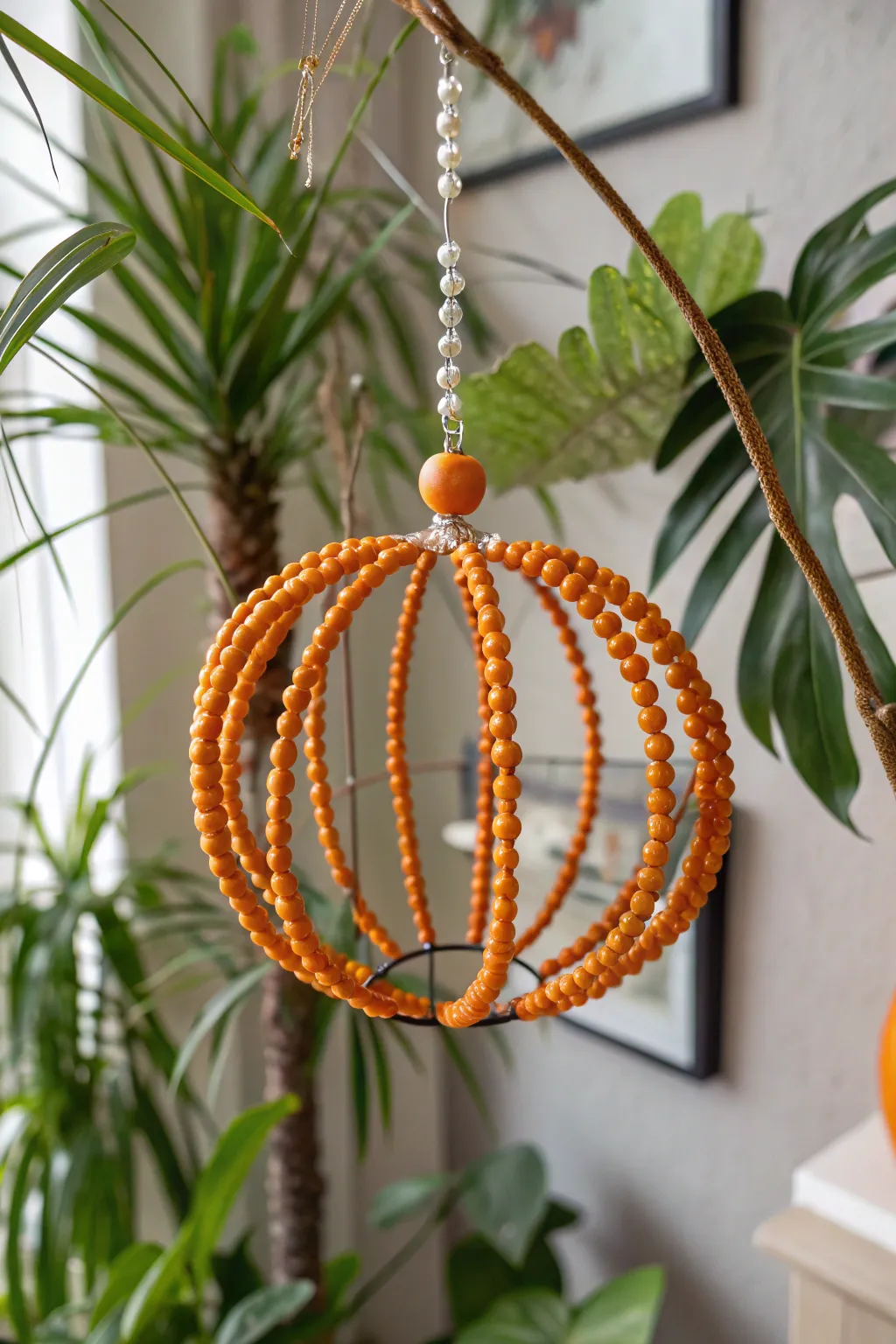 Add a touch of festive elegance with handcrafted pumpkin bead ornaments, perfect for a minimalist boho vibe.