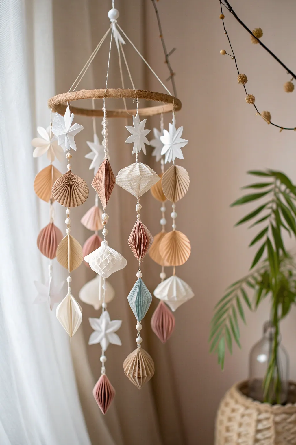 Elevate your space with the serene beauty of a handcrafted paper mobile – where sustainability meets style.