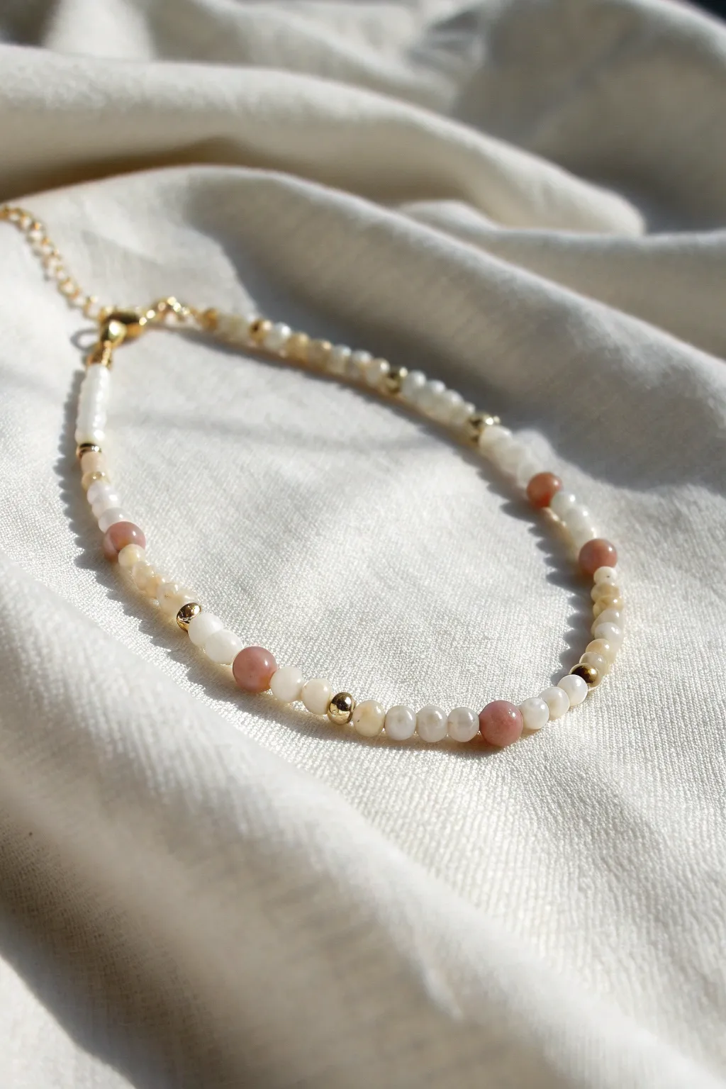 Elevate your bracelet stack with a mix of bead sizes for a touch of minimalist elegance.