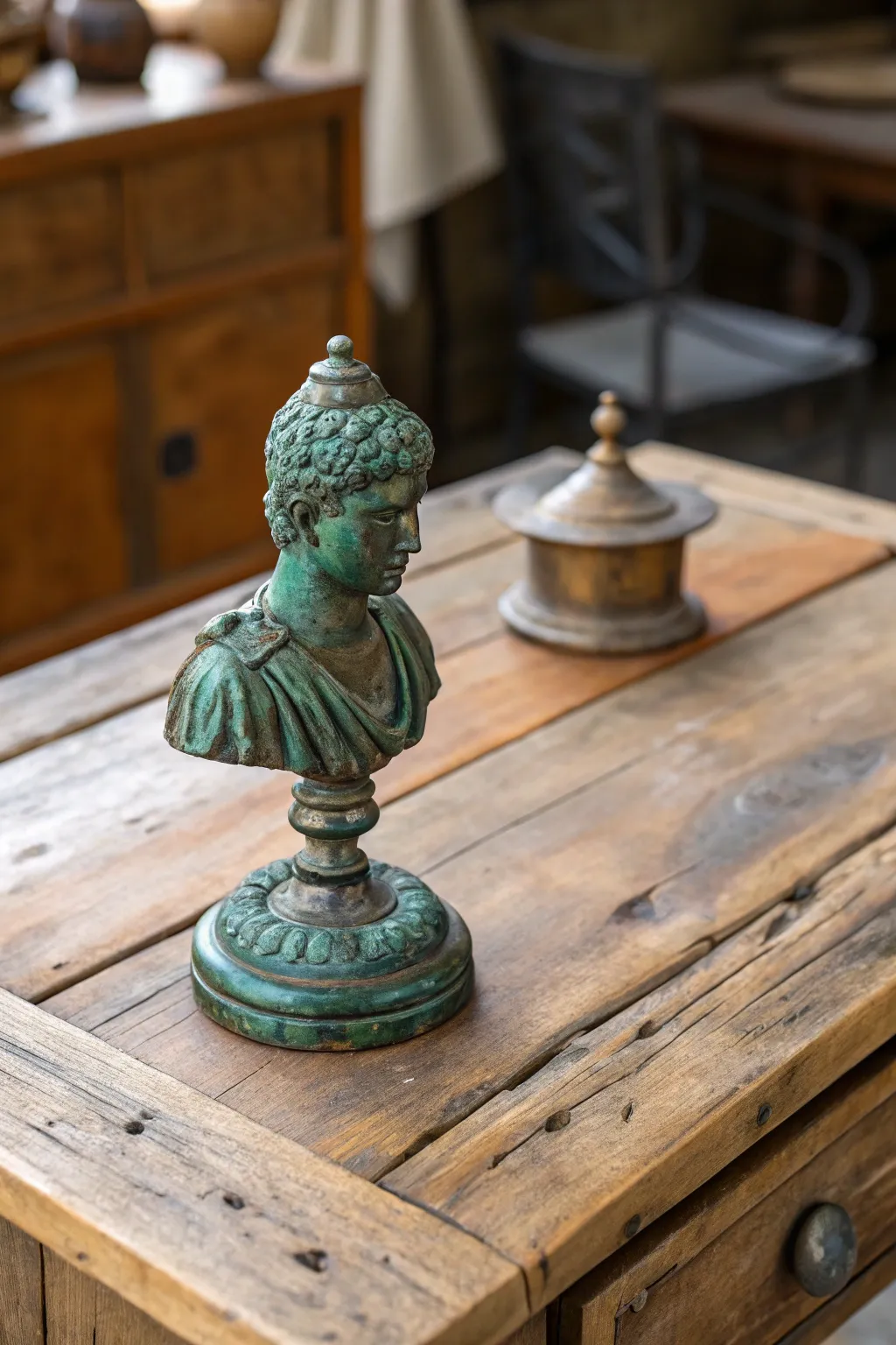 A vintage bronze sculpture adds character to a rustic table.