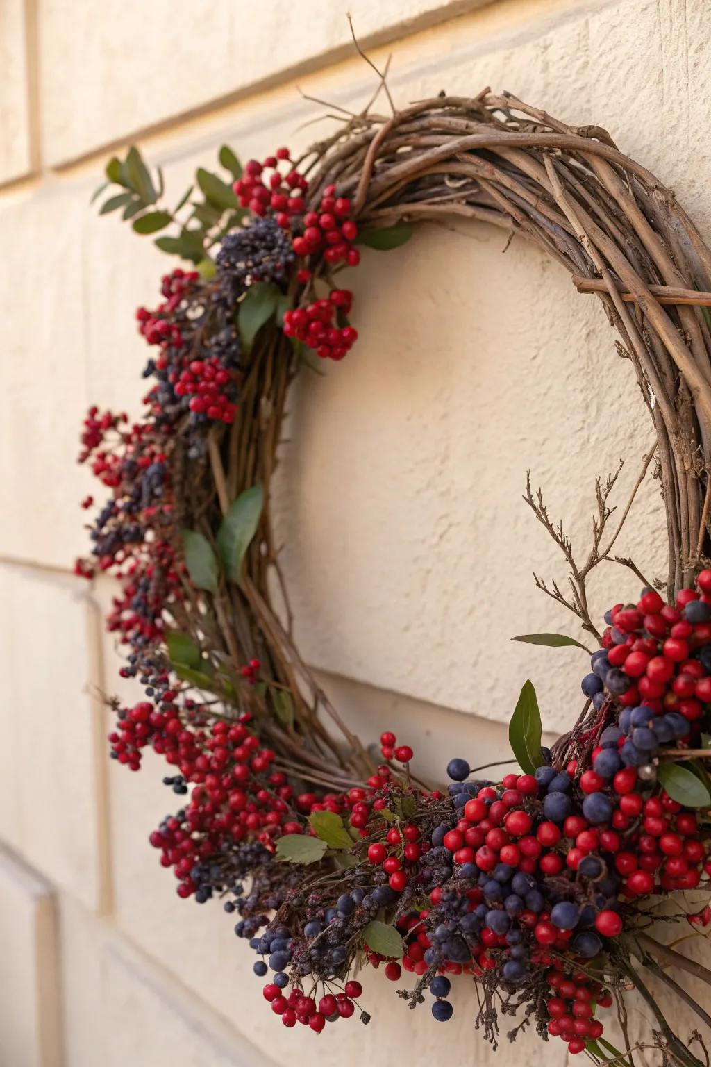 Embrace timeless elegance with a grapevine and berry wreath, where nature meets minimalism.