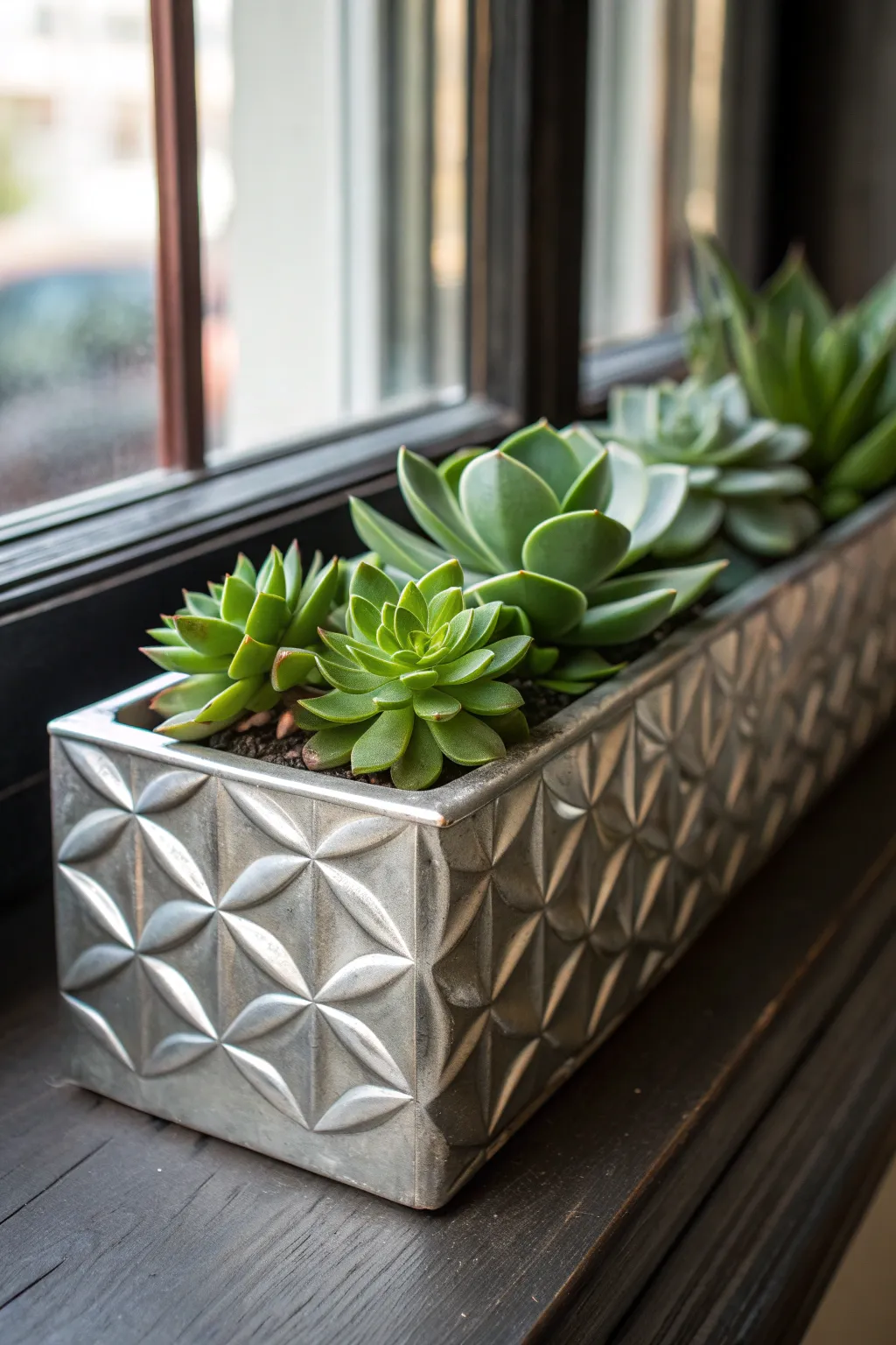 Elevate your windowsill with a modern, handcrafted aluminum planter.