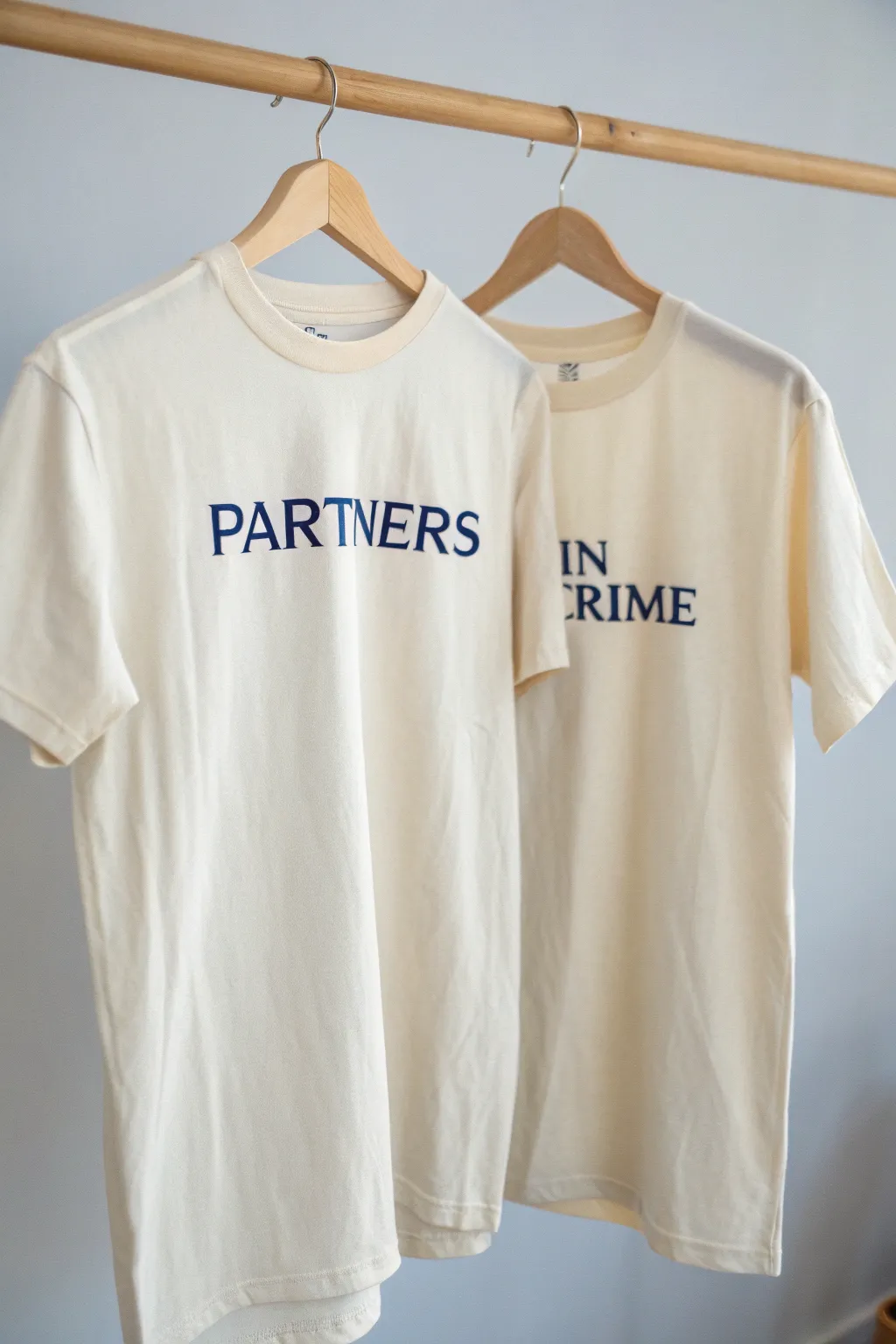Celebrate your unbreakable bond with these chic 'Partners in Crime' shirts - where minimalism meets playful charm!